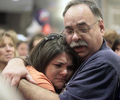 Charisa Coulter, one of 10 Americans detained in Haiti, returns to the waiting arms of her father, Mel Coulter, at the Boise Airport on Saturday.  (Associated Press)