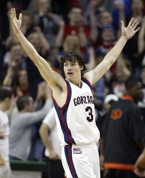 Gonzaga's Adam Morrison throws his arms up at the end of the game after scoring the winning shot in the closing seconds of their 64-62 win over Oklahoma State in Seattle Saturday, Dec. 10,  2005. (AP Photo/John Froschauer) ORG XMIT: WAJF105 (John Froschauer / The Spokesman-Review)