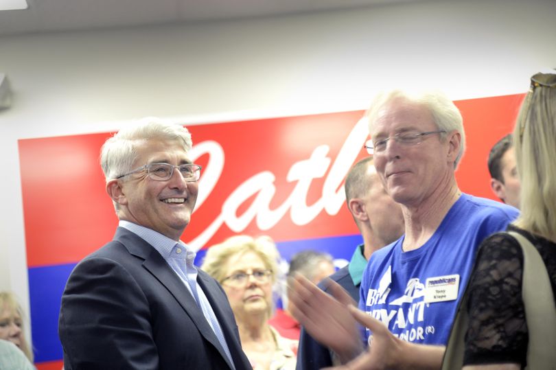 Gubernatorial candidate Bill Bryant, left, smiles as returns show him in a close race with incumbent Jay Inslee in the Washington primary election Tuesday, Aug. 2, 2016, at a party for Republican candidates and their supporters in Spokane. (Jesse Tinsley / The Spokesman-Review)