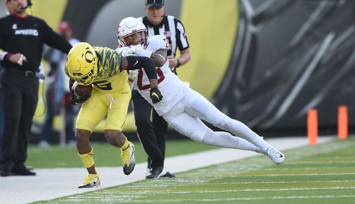 WSU and Oregon battle it out during the first half of a college football game on Saturday, October, 2017, at Autzen Stadium in Eugene, Ore. (Tyler Tjomsland / The Spokesman-Review)