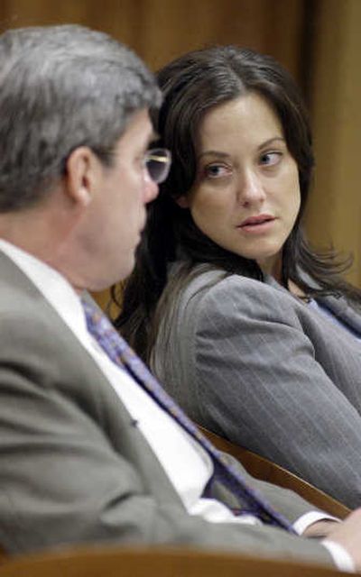 
Mechele Linehan talks with her lawyer during her murder trial. Linehan is accused of conspiring to kill her former fiance in 1996. Associated Press
 (Associated Press / The Spokesman-Review)