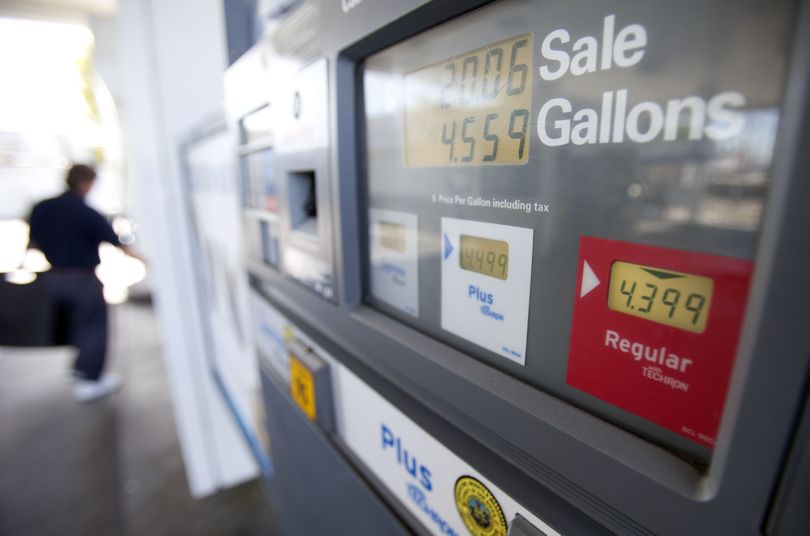 In this Feb. 21 photo, a man passes a gas pump showing the price of regular gasoline at a gas station, in San Diego. A sharp jump in gas prices drove a measure of consumer costs up in February. But outside higher pump prices, inflation stayed mild. (AP/Gregory Bull)
