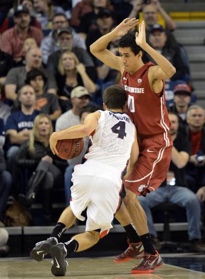 Zags’ Kevin Pangos drives against Dexter Kernich-Drew. Pangos led all scorers with 27 points. (Jesse Tinsley)