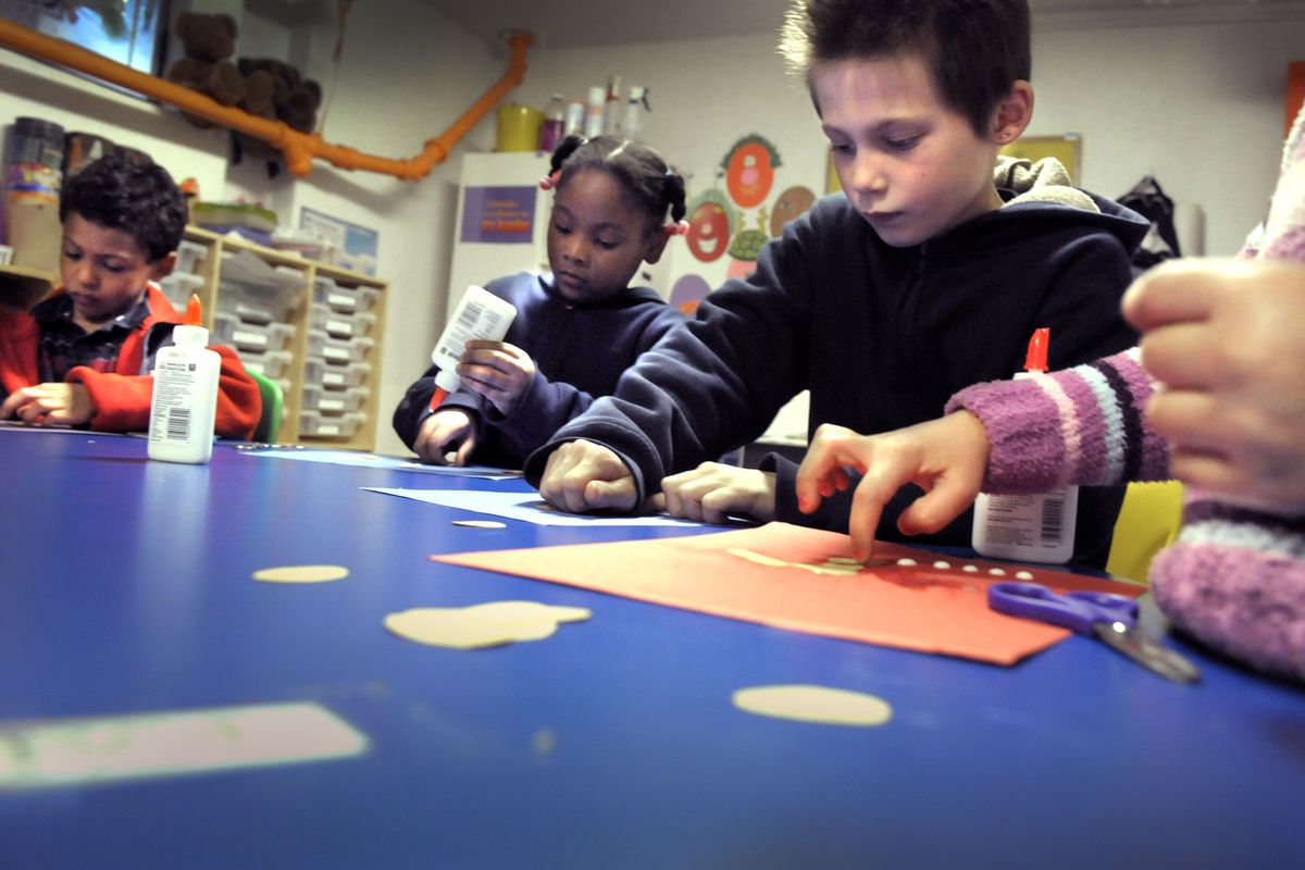 Cailen Clark, Murjoni Brown and Kalub Lacy, from left, participate in an after-school program at the Martin Luther King Jr. Family Outreach Center. The center’s program has received funding from the Women Helping Women fund for several years. (Christopher Anderson)