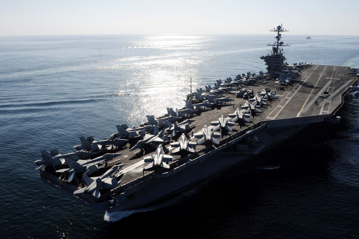 In this November file photo provided by the U.S. Navy, the Nimitz-class aircraft carrier USS John C. Stennis transits the Strait of Hormuz. (Associated Press)