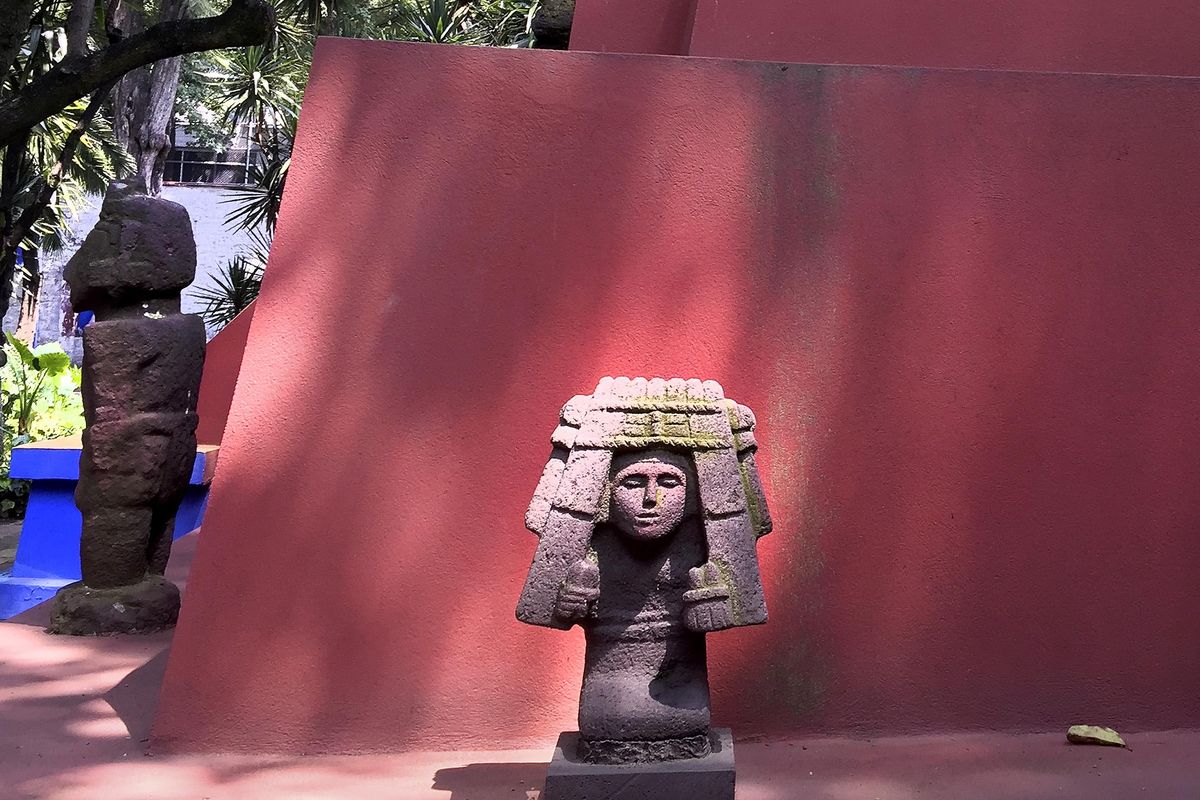 Statues are artfully placed throughout Frida Kahlo's courtyard garden, which has become a popular tourist destination in Mexico City. (Kavita Kumar / TNS)