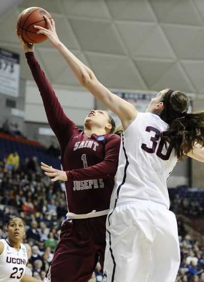 UConn’s Breanna Stewart, right, is one of three Huskies averaging more than two blocks a game. (Associated Press)