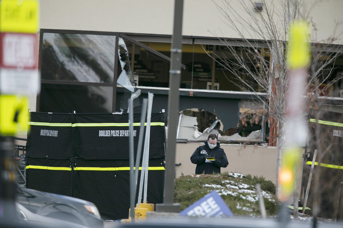 Police work on the scene outside of a King Soopers grocery store where authorities say multiple people were killed in a shooting, Monday, March 22, 2021, in Boulder, Colo..  (Joe Mahoney)