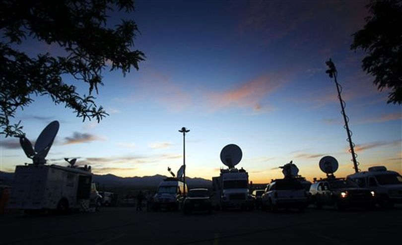 Media vehicles in the parking lot of the Fred House Training Center covering the execution of Ronnie Lee Gardner  at the Utah State Prison Thursday, June 17, 2010. (AP Photo/Deseret News, Scott G. Winterton) (Scott Winterton / AP Photo/Deseret News, Scott G. Winterton)