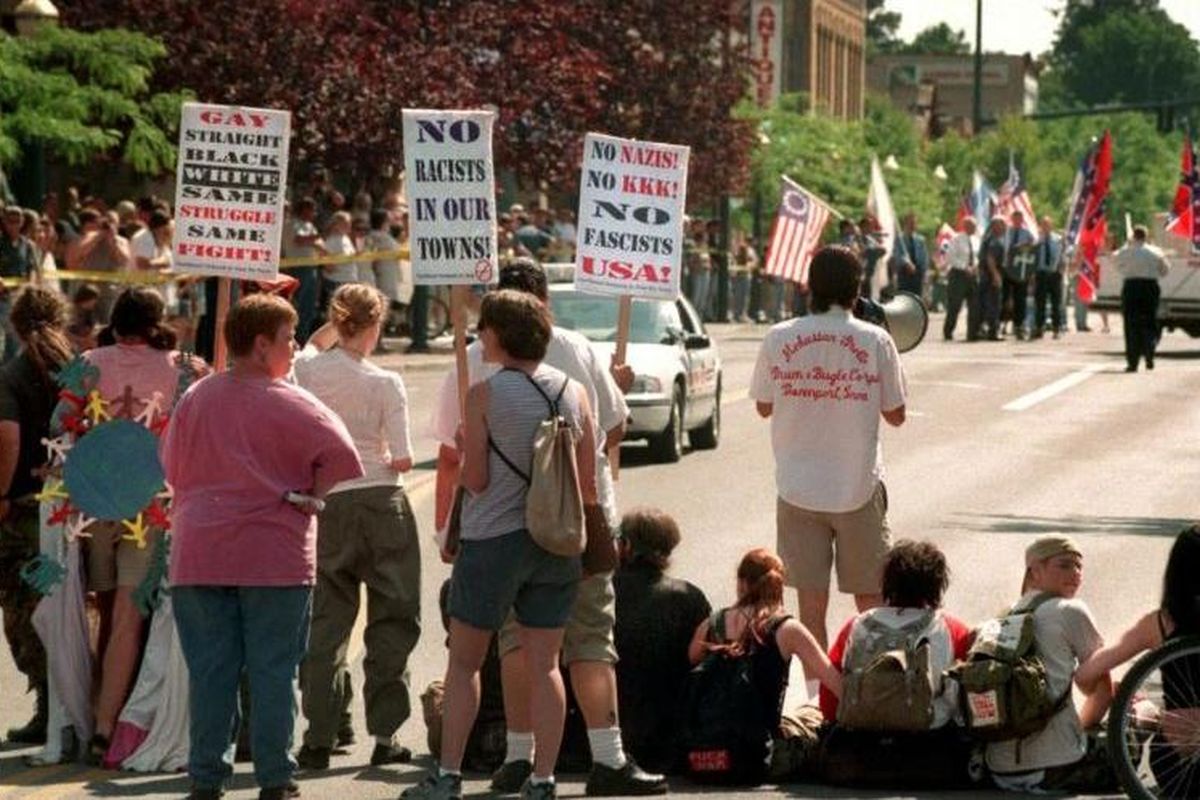 In this 1999 file photo, Aryan Nations parade was rerouted onto 4th Ave after protesters blocked Sherman Ave. (File photo / SR)
