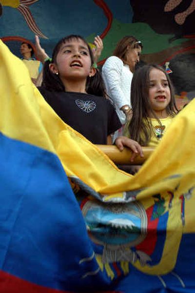 
Ecuadoreans celebrate the end of the state emergency in Quito, Ecuador, on Saturday. Ecuador's president called off a state of emergency in the capital less than 24 hours after imposing it.
 (Associated Press / The Spokesman-Review)