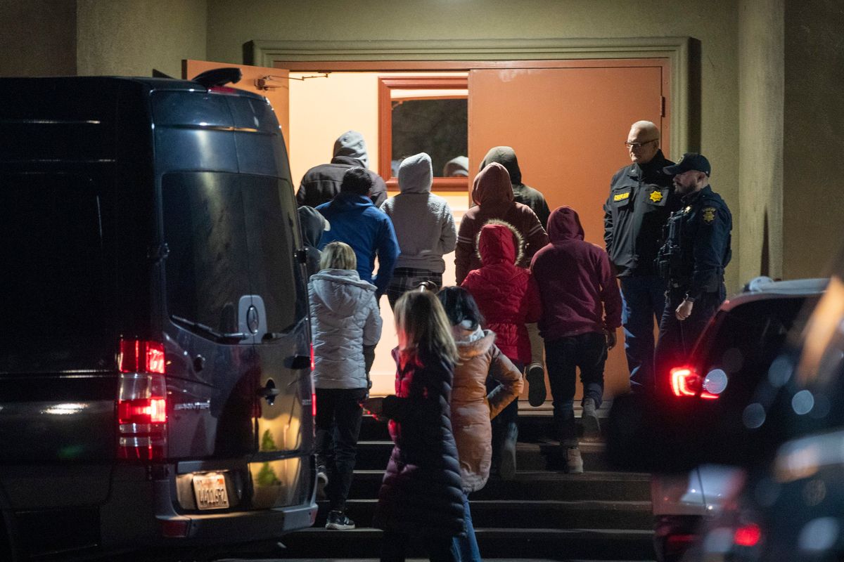 A van load of people are brought to the family reunification center at the IDES Hall in Half Moon Bay, Calif., Monday, Jan. 23, 2023, after a gunman shot and killed seven people.  (Karl Mondon/Bay Area News Group)