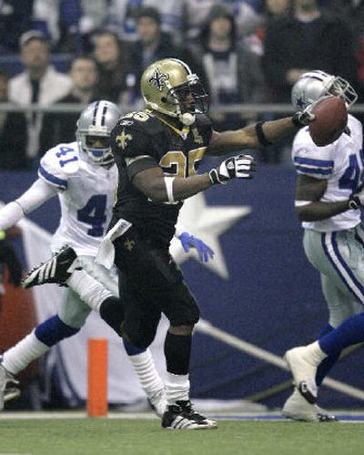 
New Orleans Saints running back Reggie Bush (25) celebrates his 61-yard touchdown run. 
 (Associated Press / The Spokesman-Review)