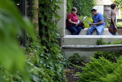 Charlotte Weaver and her son Dereke  Weaver consider  his options at North Idaho College on Thursday. He’s considering taking  automotive technology classes. (Kathy Plonka / The Spokesman-Review)