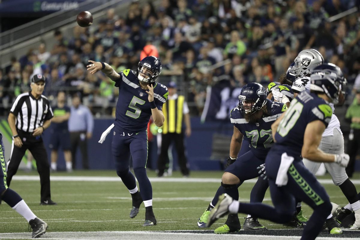 Seattle Seahawks quarterback Alex McGough throws a pass against the Oakland Raiders during the second half of an NFL football preseason game Thursday, Aug. 30, 2018, in Seattle. (Elaine Thompson / AP)