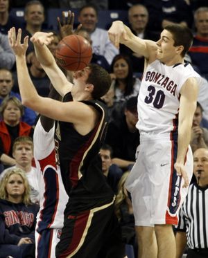 Gonzaga's Mike Hart blocks a shot by Santa Clara's Marc Trasolini during the second half of their NCAA college basketball game at the McCarthey Athletic Center in Spokane, Wash., on Feb. 25, 2010.  Gonzaga beat Santa Clara 88-51. 
  (Associated Press)