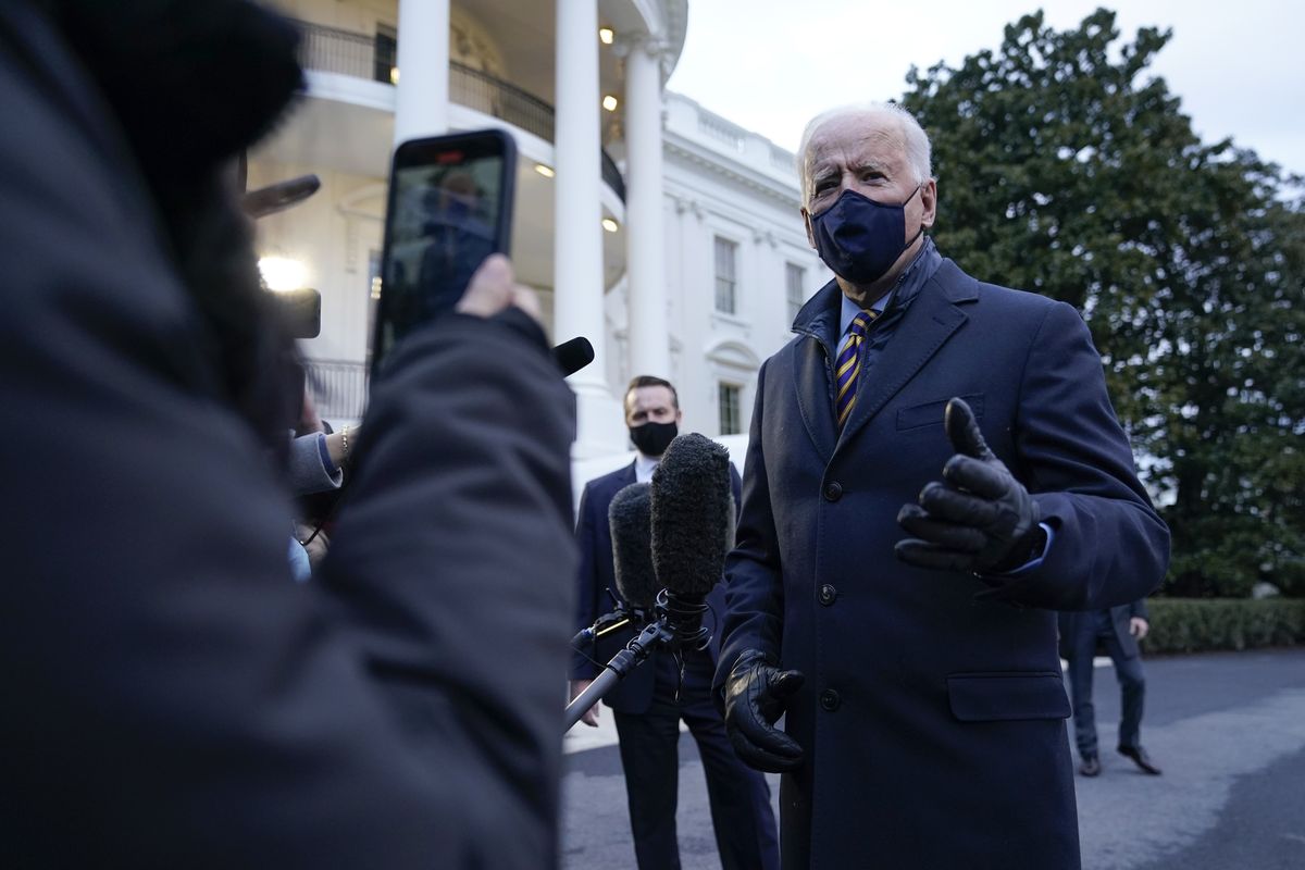 President Joe Biden speaks to reporters on the South Lawn of the White House before boarding Marine One, Tuesday, Feb. 16, 2021, in Washington. Biden is traveling to Milwaukee to participate in a town hall event.  (Patrick Semansky)