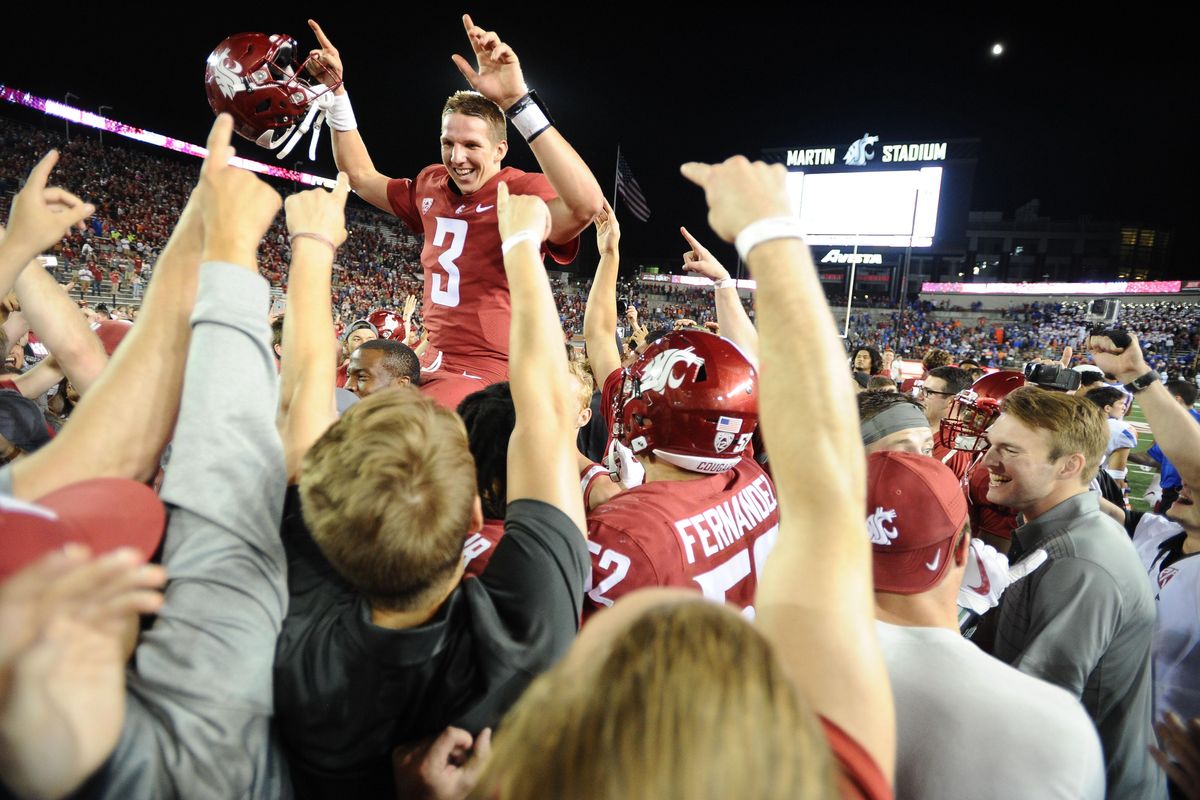 Washington State Cougars quarterback Tyler Hilinski (3) is mobbed by teammates after WSU defeated Boise State in triple overtime on Saturday, September 9, 2017, at Martin Stadium in Pullman, Wash. Tyler Tjomsland/THE SPOKESMAN-REVIEW (Tyler Tjomsland / The Spokesman-Review)
