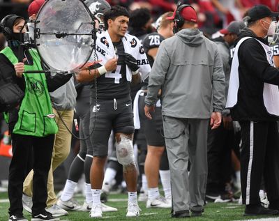 Washington State Cougars quarterback Jayden de Laura (4) stands on the sidelines with an injured knee during the second half of a college football game on Saturday, Sept. 18, 2021, at Gesa Field in Pullman, Wash. USC won the game 45-14.  (Tyler Tjomsland/The Spokesman-Review)