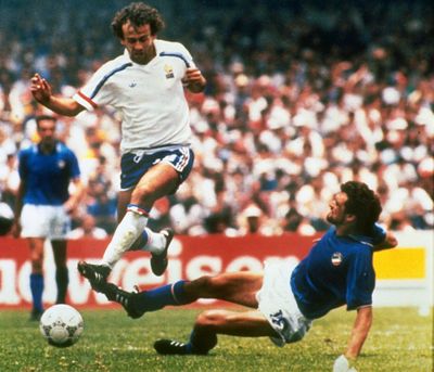 In this  photo dated June 17, 1986, Michel Platini, left, of France dribbles past Italian forward Alessandro Altobelli in their World Cup eight finals in Mexico City’s Azteca Stadium. France won 2-0 to advance to the quarterfinals of the tournament and Italy was eliminated. Affectionately nicknamed “Le Roi” (The King), Michel Platini bestrode the soccer field with inimitable elegance as the world’s best player of the early 1980s, but his lofty reputation seems to have been tainted. (Associated Press)