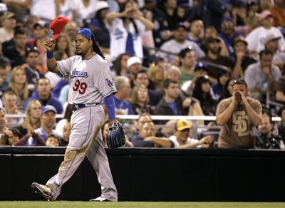 Padres fan gives Manny Ramirez earful during game.  (Associated Press / The Spokesman-Review)