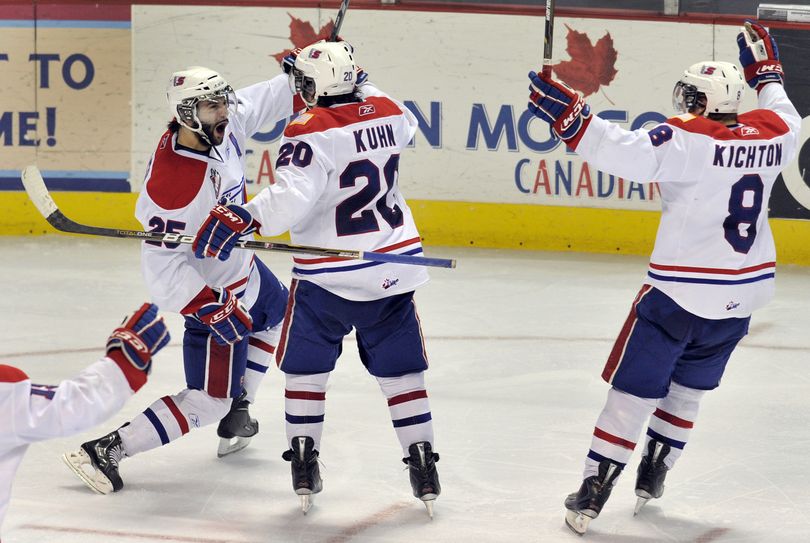 Spokane's Levko Koper (25) celebrates scoring the winning goal in overtime as the Chiefs beat the Tri-City Americans 5-4. (Colin Mulvany)