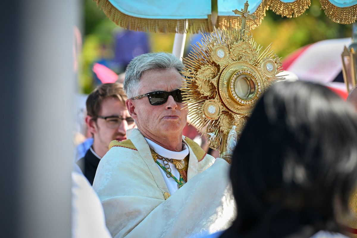 Catholic Bishop Thomas Daly carries the monstrance during the Eucharistic Expo procession in Riverfront Park, Sunday, Sept. 10, 2023, in Spokane. Daly said he