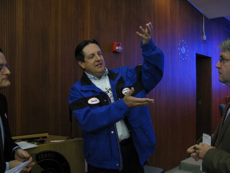 Steven Steach, plant manager at the ConocoPhillips Billings Refinery, explains the role that giant coke drums play in the refinery process after a hearing at the Idaho Transportation Department on Friday. Conoco wants to truck in giant replacements for its existing drums. (Betsy Russell)