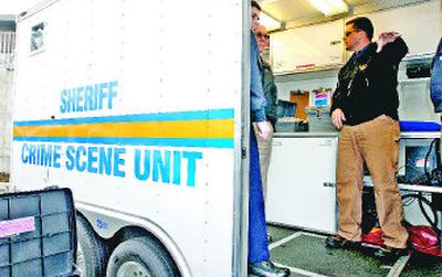 
Eric Clemensen of the FBI,  right, points out the features of the new Crime Scene Unit  to Shoshone County Sheriff Chuck Reynalds, second from left, and Post Falls Police Lt. Scot Haug   on Tuesday  at the Post Falls Police Department. Below is a fingerprint kit on board  the  crime scene trailer. 
 (Photos by JESSE TINSLEY / The Spokesman-Review)