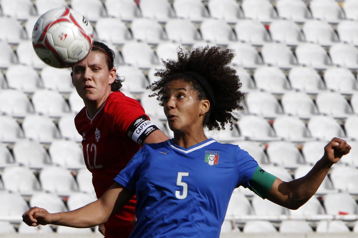 Christine Sinclair, left, and her Canadian teammates are in the spotlight as hosts. (Associated Press)
