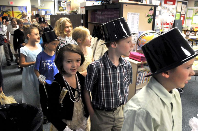 Third-graders march into their classrooms for the Fairy Tale Ball at Sunrise Elementary.