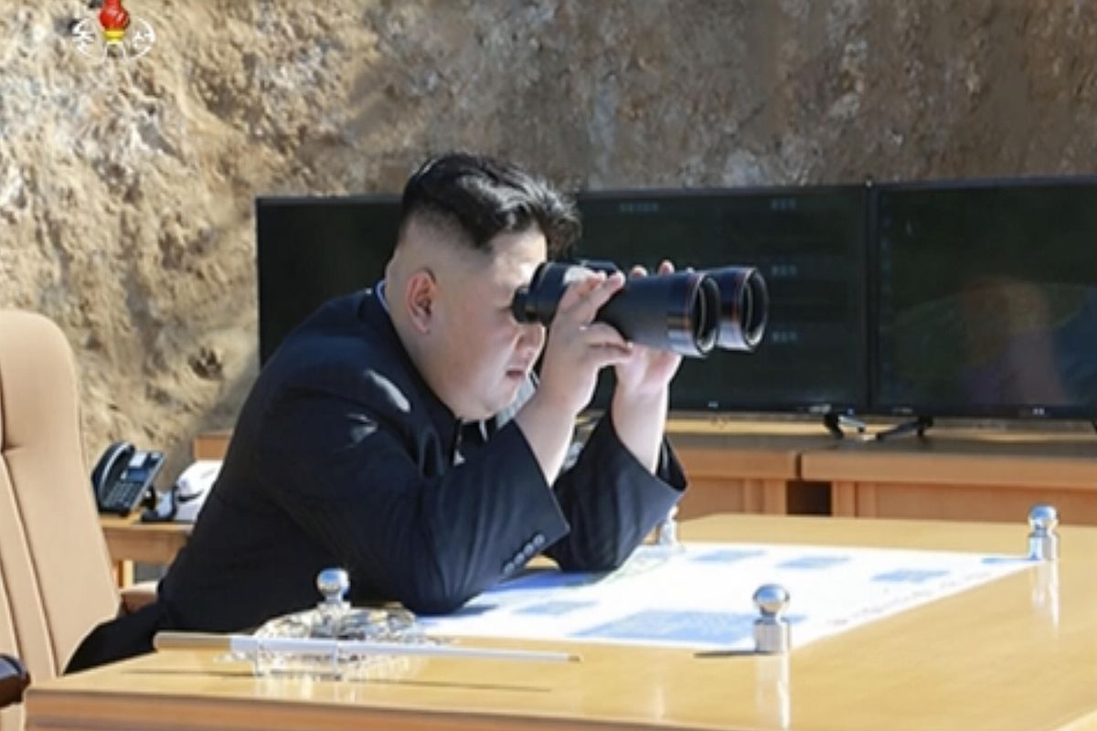 This image made from video of a news bulletin aired by North Korea’s KRT on Tuesday, July 4, 2017, shows what is  said to be North Korea leader Kim Jung Un, center, using binoculars to watch the launch of a Hwasong-14 intercontinental ballistic missile in North Korea’s northwest. Independent journalists were not given access to cover the event depicted in this photo. (KRT via Associated Press)