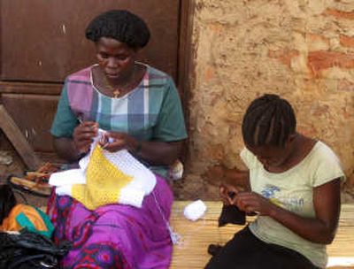 Mary Akello, left, and Teddy Alanyo crochet hats in Gulu, Uganda. The hats will be distributed by Krochet Kids International, a program started by three Spokane natives. Special to
(Photos by Laura-Claire Corson Special to / The Spokesman-Review)