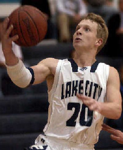 
Lake City's Cory Kreighbaum breaks away for a basket Tuesday night in a 48-36 victory over Lewis and Clark.
 (Tom Davenport/ / The Spokesman-Review)