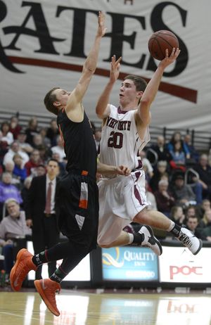 Whitworth's Colton McCargar (20) drives to the basket as Lewis and Clark's Serg Ovchinnikov (2) defends in the second half of their men's college basketball game, Thursday, Feb. 21, 2013, at Whitworth University. (Colin Mulvany / The Spokesman-Review)