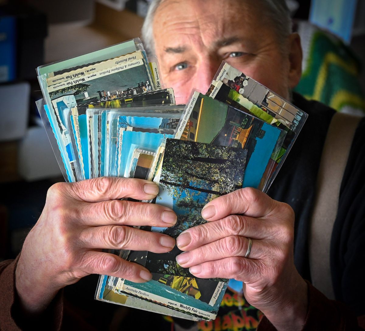Jerry Smith, of Spokane, displays some of his 116 unique postcards depicting Expo '74..  (DAN PELLE/THE SPOKESMAN-REVIEW)
