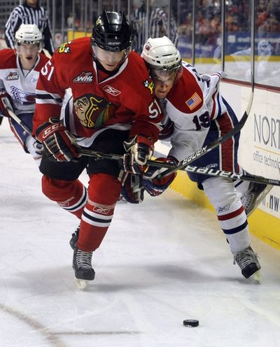 Derrick Pouliot, left, collides with Chiefs’ Colin Valcourt. (Dan Pelle)