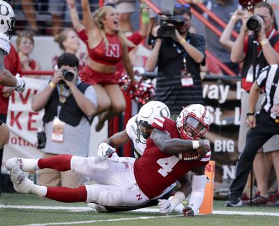 Nebraska quarterback Tommy Armstrong Jr.  shakes a tackle attempt by Oregon’s Khalil Oliver to score the winning touchdown in the Huskers’ 35-32 escape against the Ducks in Lincoln, Nebraska. (Nati Harnik / AP)