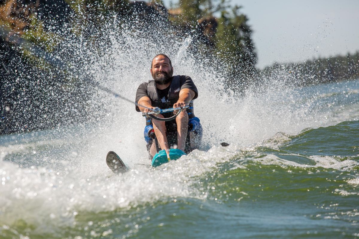 James Herdon, 39, waterskis at speeds topping 20 miles per hour on Clear Lake on July 14. Herdon and his family attended Skifest, which had 15 preregistered participants to waterski, organized by St. Luke’s Rehabilitation Institute. (Libby Kamrowski / The Spokesman-Review)