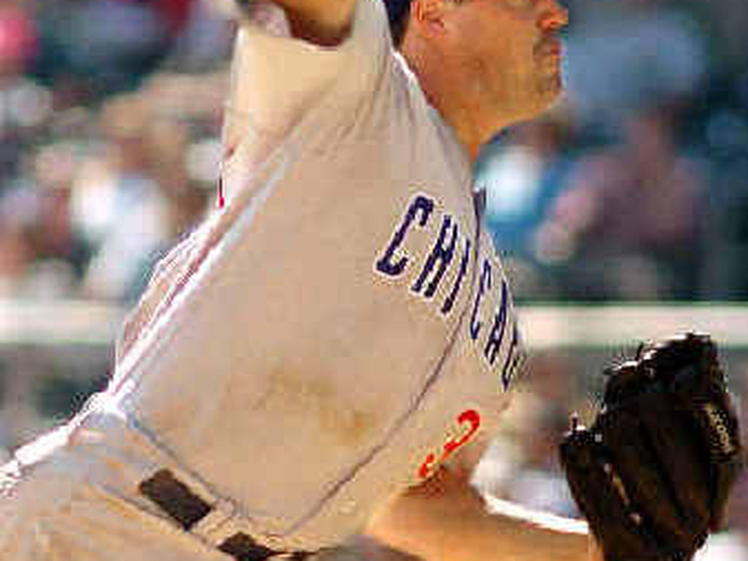 San Diego Padres starting pitcher Greg Maddux delivers a pitch to