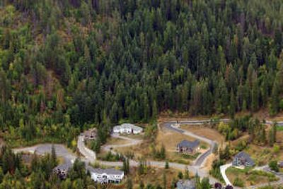 
New luxury homes are being built along the edge of national forestland in the Hayden Lake area.  