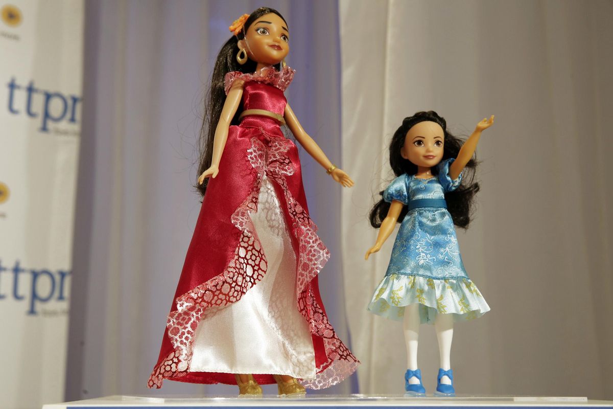 This Thursday, Oct. 6, 2016, photo shows Elena of Avalor, left, and Princess Isabel, from The Disney Store, on display at the annual TTPM Holiday Showcase, in New York. Toy companies are offering products that are more inclusive, from Barbie dolls in all shapes, sizes and skin tones to baby dolls aimed at boys. Toy companies are also offering dolls that represent different disabilities. But still experts and parents say more work needs to be done. (Richard Drew / Associated Press)