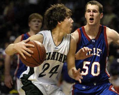 
Willapa Valley's Zach Baugher (50) moves in to defend a drive to the basket by Selkirk's Travis Zimmerman in Thursday's State B quarterfinal. Willapa Valley won by 21 points to advance to the semifinals.
 (Christopher Anderson/ / The Spokesman-Review)