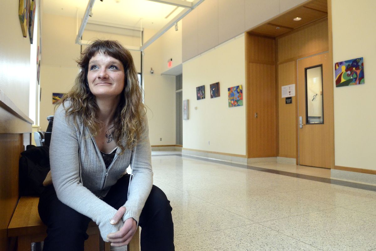 Aubrey Shults sits outside the room used for Community Court on March 1 at the Spokane Public Library downtown. The former heroin addict has been in Community Court for offenses in the past, and continues to check with the court to make sure she is completing assigned tasks. (Jesse Tinsley)