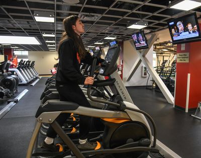 Eastern Washington University sophomore Kyle Cole, of Medical Lake, Wash., keeps an eye on the impeachment hearing while exercising at the University Recreation Center on campus, Wednesday, Nov. 13, 2019, in Cheney, Wash. Dan Pelle/THE SPOKESMAN-REVIEW (Dan Pelle / The Spokesman-Review)