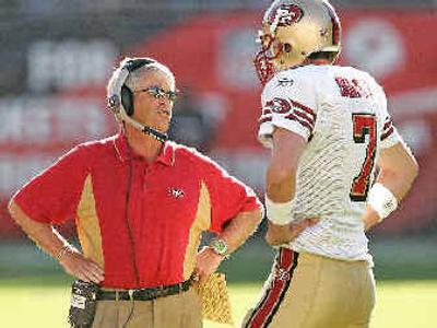 
San Francisco coach Dennis Erickson, left, isn't going anywhere, yet. 
 (Associated Press / The Spokesman-Review)
