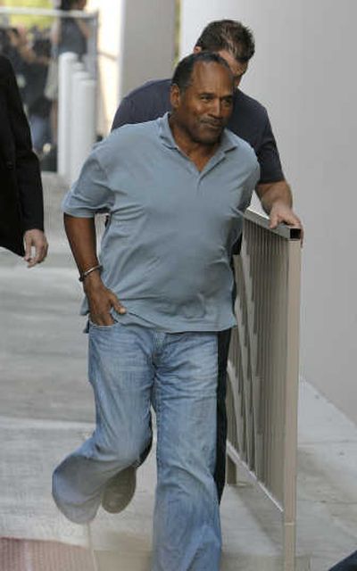 
O.J. Simpson, seen Sunday,  is to be arraigned today on felony charges in the theft of memorabilia in a Las Vegas hotel room. Associated Press
 (Associated Press / The Spokesman-Review)