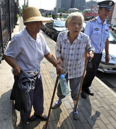 Wang Xiuying, 77, left, and Wu Dianyuan, 79,  wait to apply for a protest permit  in Beijing on Monday.  (Associated Press / The Spokesman-Review)