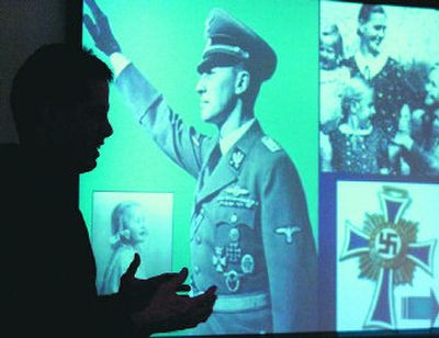 
Above, images from the past surround Central Valley High School teacher Steve Bernard as he instructs his students on the history of the Holocaust in Nazi Germany during class last Thursday. 
 (Photos by DAN PELLE / The Spokesman-Review)
