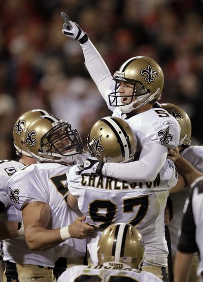 Garrett Hartley, right, and Saints celebrate. (Associated Press)